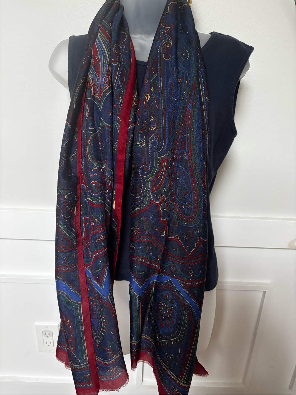 luxurious wool-silk blend scarf styled with a deep navy blue background